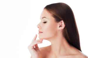 A profile shot of a woman after peptide therapy treatments