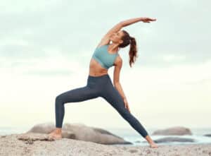 A woman doing yoga after NAD+ therapy in Chicago